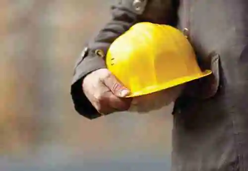Man holding construction helmet.